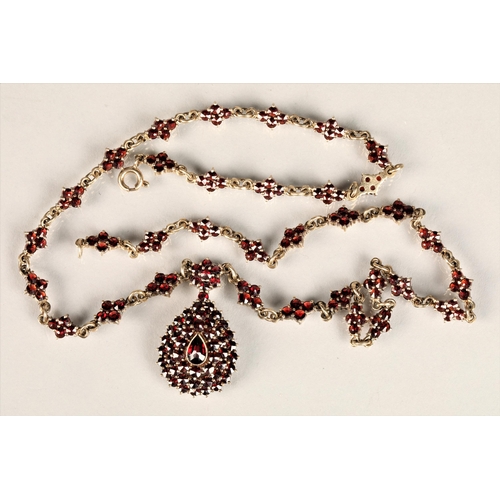 129 - Ladies Victorian garnet necklace, central teardrop garnet surrounded by a cluster of garnets in tear... 