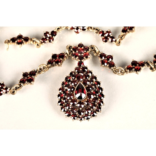 129 - Ladies Victorian garnet necklace, central teardrop garnet surrounded by a cluster of garnets in tear... 