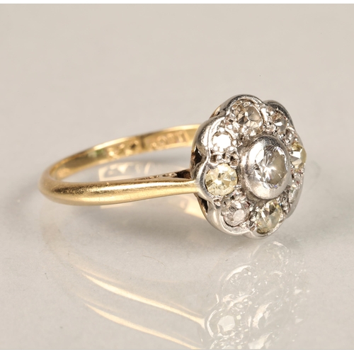 130 - Ladies 18ct yellow gold daisy diamond cluster ring set with a platinum mount, ring size L