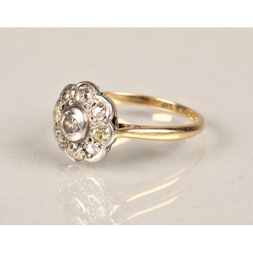 130 - Ladies 18ct yellow gold daisy diamond cluster ring set with a platinum mount, ring size L