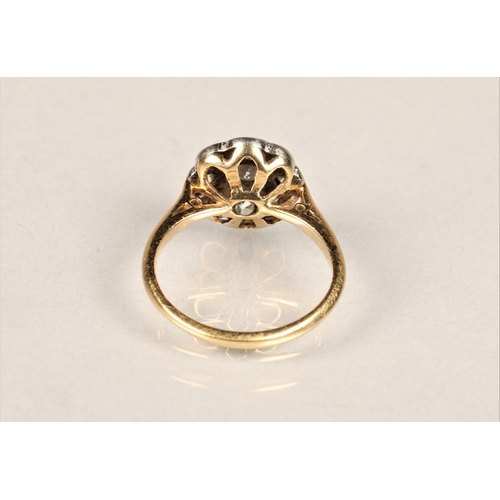 130 - Ladies 18ct yellow gold daisy diamond cluster ring set with a platinum mount, ring size L