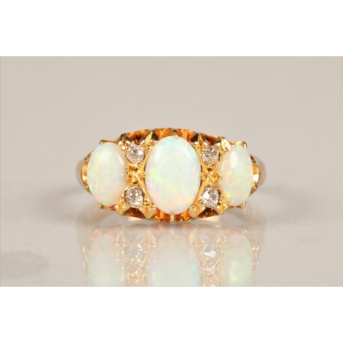 131 - Ladies 18ct yellow gold opal ring, three graduated opals interspersed with four small diamonds set o... 