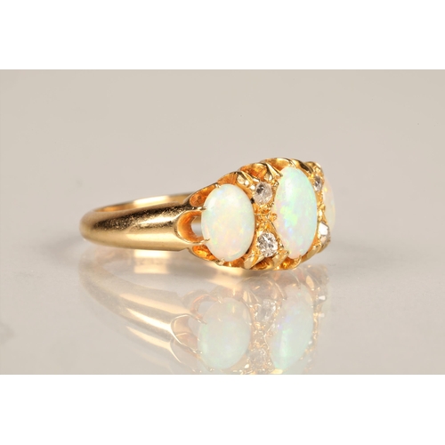 131 - Ladies 18ct yellow gold opal ring, three graduated opals interspersed with four small diamonds set o... 