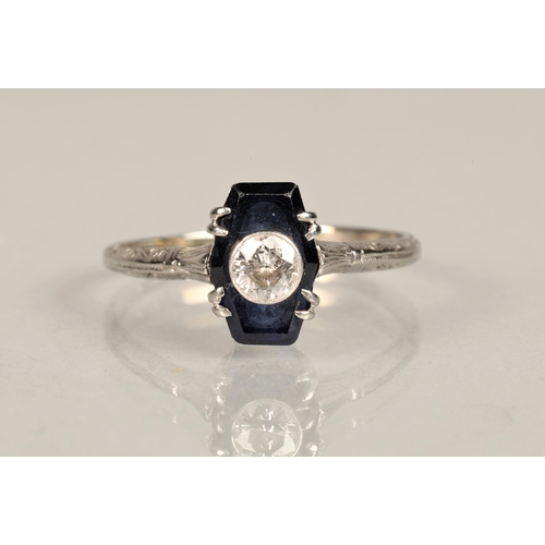 137 - Ladies diamond and sapphire ring, 0.25 carat diamond set in the centre of a sapphire set on unmarked... 