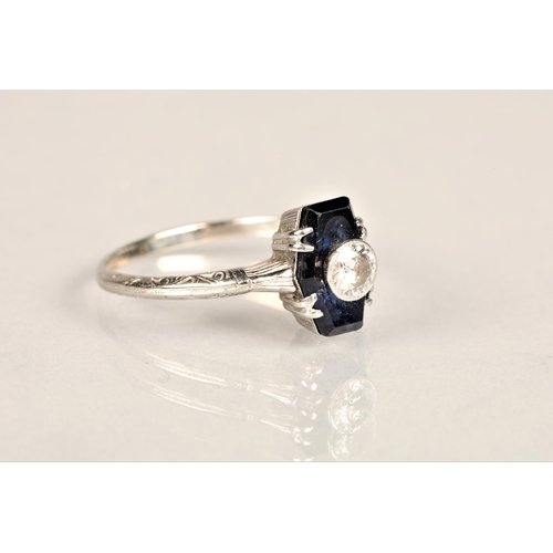 137 - Ladies diamond and sapphire ring, 0.25 carat diamond set in the centre of a sapphire set on unmarked... 