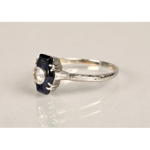 137 - Ladies diamond and sapphire ring, 0.25 carat diamond set in the centre of a sapphire set on unmarked... 