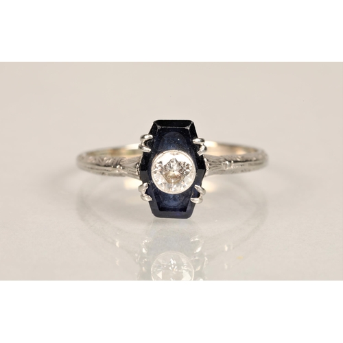 137 - Ladies diamond and sapphire ring, 0.25 carat diamond set in the centre of a sapphire set on unmarked... 