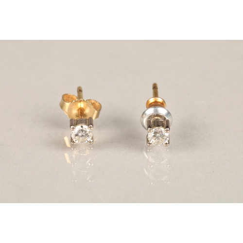 140 - Pair of diamond stud earrings, on unmarked yellow and white metal, each stone 0.1 carat