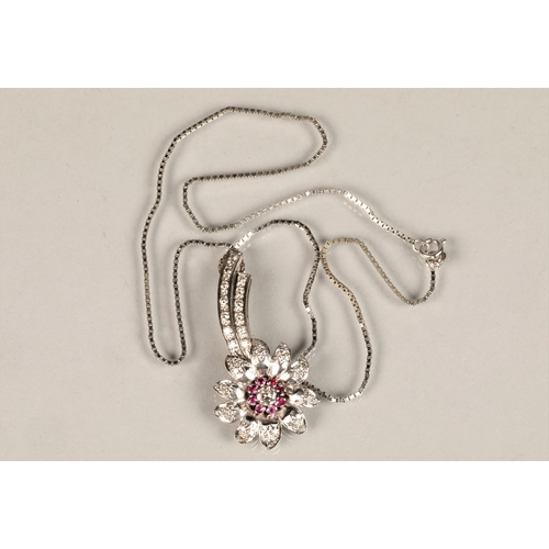 141 - Ladies diamond & ruby floral spray pendant, central stone 0.25 carat surrounded by eight smaller... 