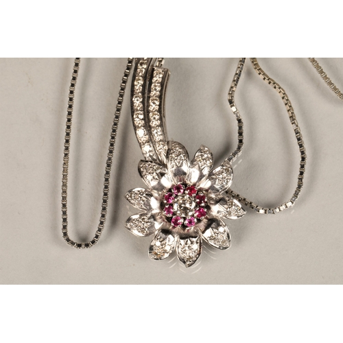 141 - Ladies diamond & ruby floral spray pendant, central stone 0.25 carat surrounded by eight smaller... 