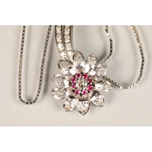 141 - Ladies diamond & ruby floral spray pendant, central stone 0.25 carat surrounded by eight smaller... 