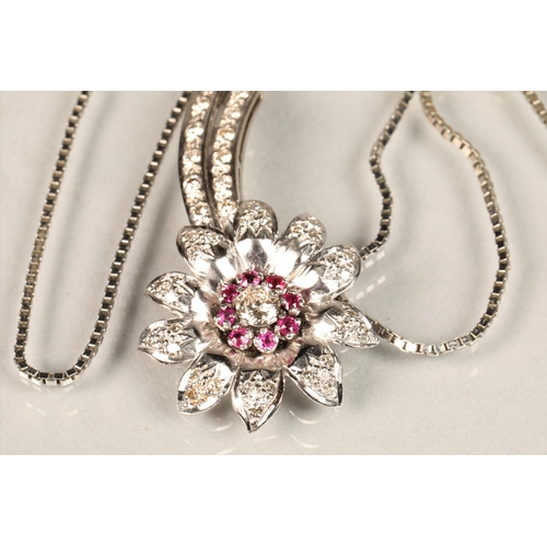 141 - Ladies diamond & ruby floral spray pendant, central stone 0.25 carat surrounded by eight smaller... 