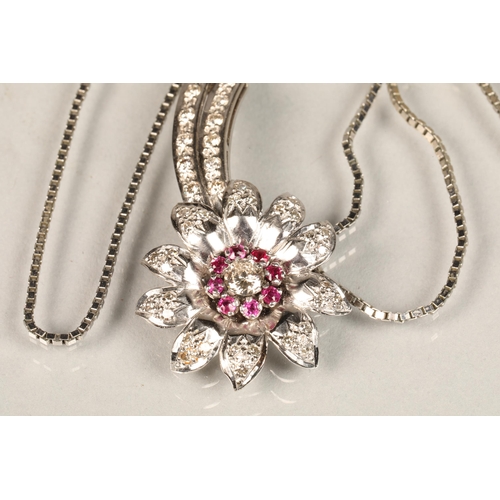 141 - Ladies diamond & ruby floral spray pendant, central stone 0.25 carat surrounded by eight smaller... 