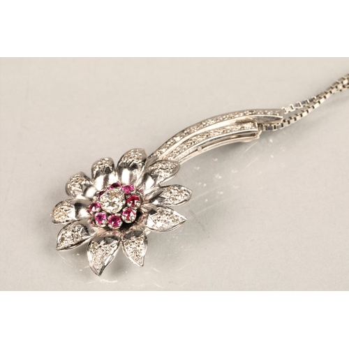 141 - Ladies diamond & ruby floral spray pendant, central stone 0.25 carat surrounded by eight smaller... 