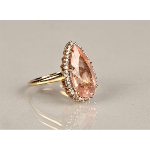 143 - Ladies 14k gold morganite and diamond ring, central teardrop morganite surround by small diamonds se... 