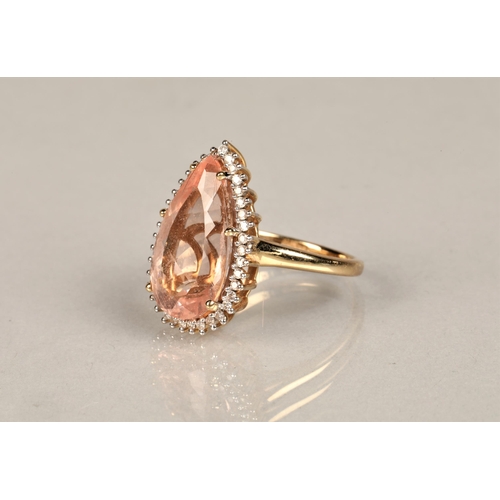 143 - Ladies 14k gold morganite and diamond ring, central teardrop morganite surround by small diamonds se... 