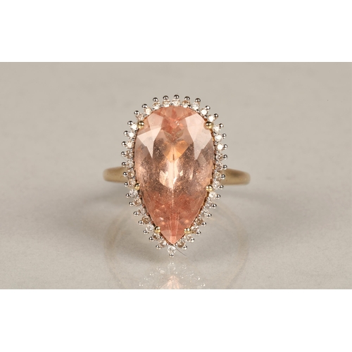 143 - Ladies 14k gold morganite and diamond ring, central teardrop morganite surround by small diamonds se... 