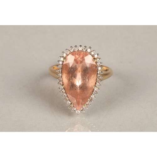 143 - Ladies 14k gold morganite and diamond ring, central teardrop morganite surround by small diamonds se... 