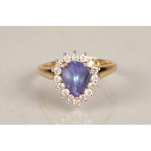 145 - Ladies 18k gold tanzanite and diamond ring, central teardrop tanzanite surrounded by sixteen small d... 