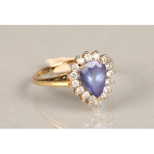 145 - Ladies 18k gold tanzanite and diamond ring, central teardrop tanzanite surrounded by sixteen small d... 