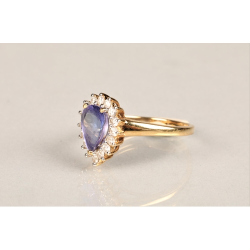 145 - Ladies 18k gold tanzanite and diamond ring, central teardrop tanzanite surrounded by sixteen small d... 