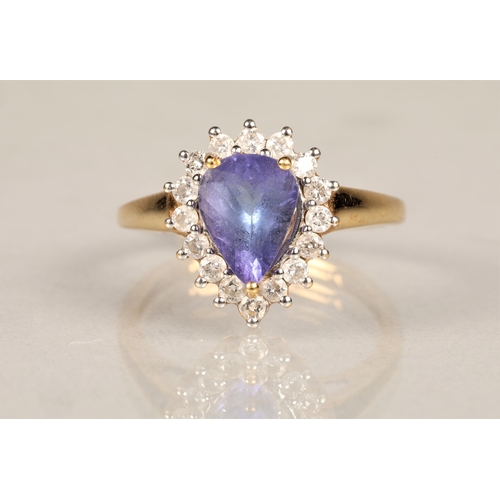 145 - Ladies 18k gold tanzanite and diamond ring, central teardrop tanzanite surrounded by sixteen small d... 