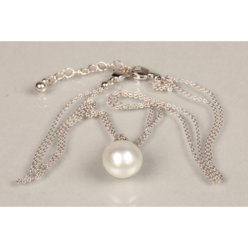 148 - Ladies 18ct white gold mounted pearl pendant with diamond chips, probably a South sea pearl. Diamete... 