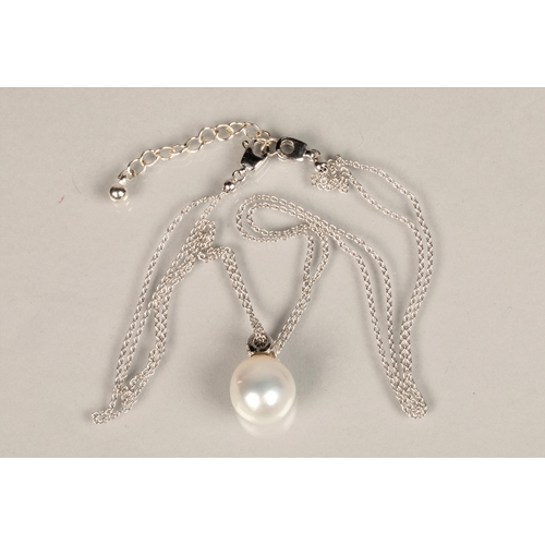 148 - Ladies 18ct white gold mounted pearl pendant with diamond chips, probably a South sea pearl. Diamete... 