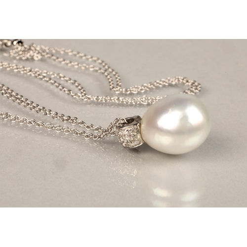 148 - Ladies 18ct white gold mounted pearl pendant with diamond chips, probably a South sea pearl. Diamete... 