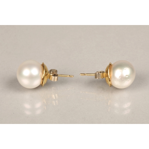 153 - Pair of 18ct yellow gold mounted pearl earrings. Probably South sea pearls, diameter 1.2cm