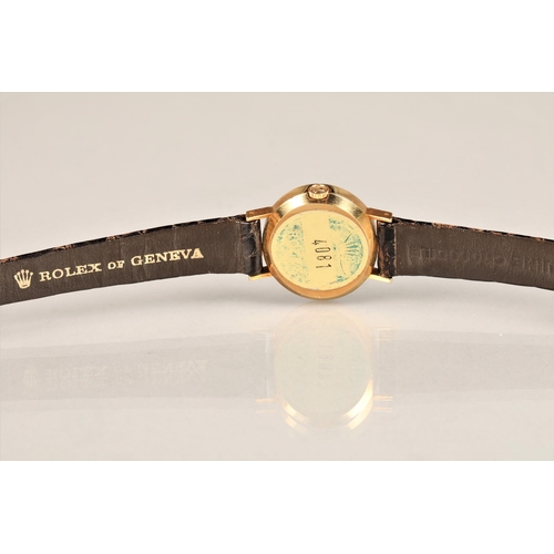 164 - Ladies 18ct gold Rolex Cellini wrist watch, on a brown leather Rolex strap, model No 4081, serial No... 