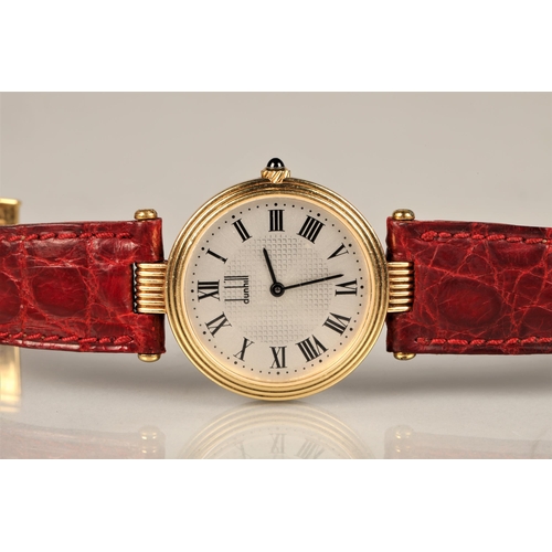 167 - Ladies 18ct yellow gold Dunhill wrist watch, silver dial with roman numeral hour markings on a leath... 