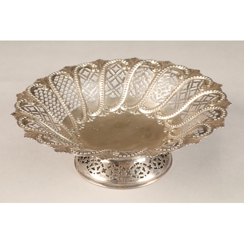 194 - Victorian pierced silver cake basket, decorated with embossed beadwork scrolls, assay marked Sheffie... 