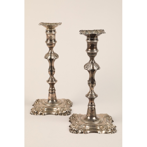 198 - Pair George II silver candlesticks, knopped baluster formed stems, raised on shaped square base, ass... 