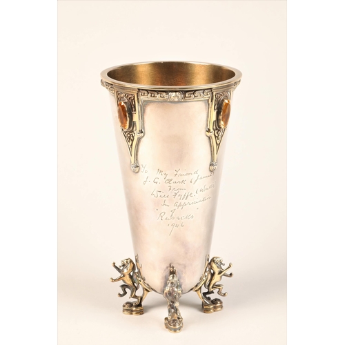 200 - Silver and silver gilt presentation vase, raised on four silver gilt lion rampant feet, celtic decor... 