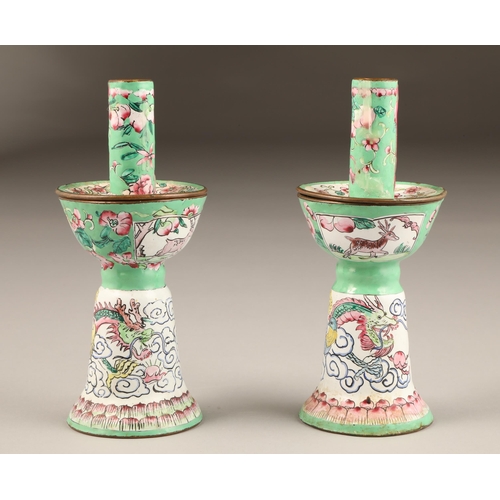 257 - Pair of Chinese canton enamel candlesticks, apple green and white enamelled ground decorated with dr... 