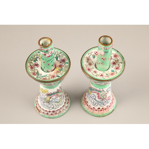 257 - Pair of Chinese canton enamel candlesticks, apple green and white enamelled ground decorated with dr... 