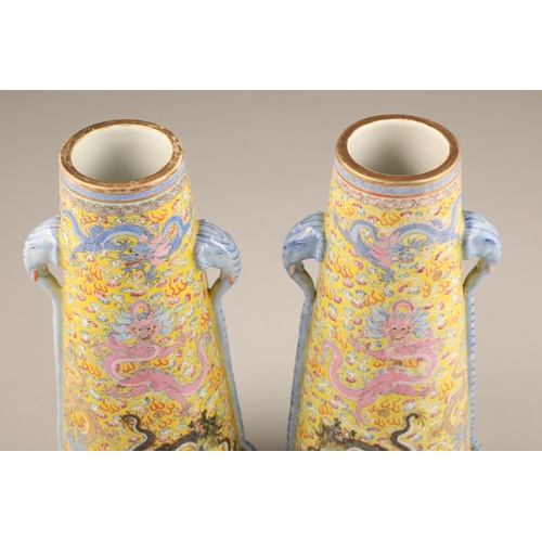 259 - Pair 20th century Chinese famille rose, yellow ground vases, tapered form with applied elephant mask... 