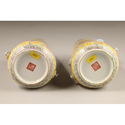 259 - Pair 20th century Chinese famille rose, yellow ground vases, tapered form with applied elephant mask... 