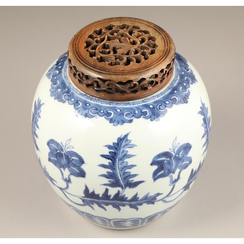 262 - 19th century Chinese blue and white ginger jar, with carved hardwood cover, the jar decorated with a... 