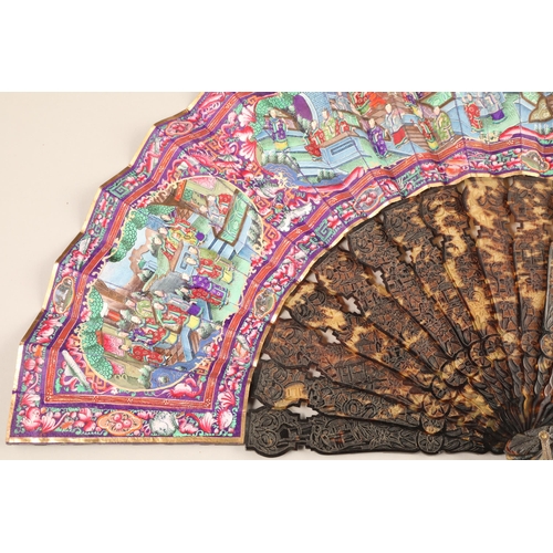 277 - 19th century Chinese folding Mandarin fan with carved tortoiseshell sticks. Fourteen leaves painted ... 