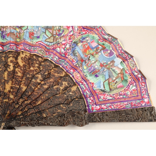 277 - 19th century Chinese folding Mandarin fan with carved tortoiseshell sticks. Fourteen leaves painted ... 