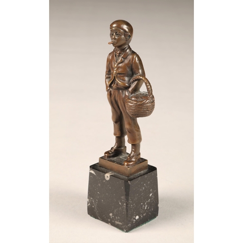 289 - EB Morty (German 20th century) bronze figure of a smoking boy with basket, height 16cm