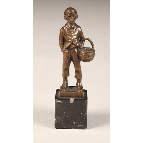 289 - EB Morty (German 20th century) bronze figure of a smoking boy with basket, height 16cm