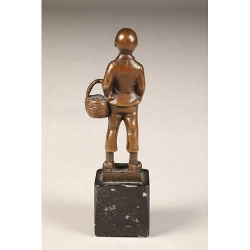 289 - EB Morty (German 20th century) bronze figure of a smoking boy with basket, height 16cm