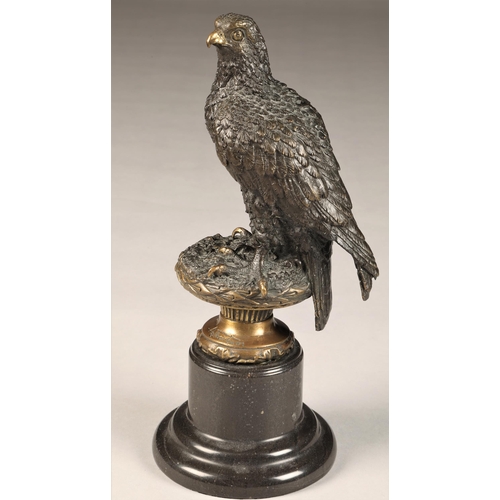 291 - After Archibald Thorburn (Scottish 1860-1935) Bronze figure of a perched golden eagle, on a marble p... 