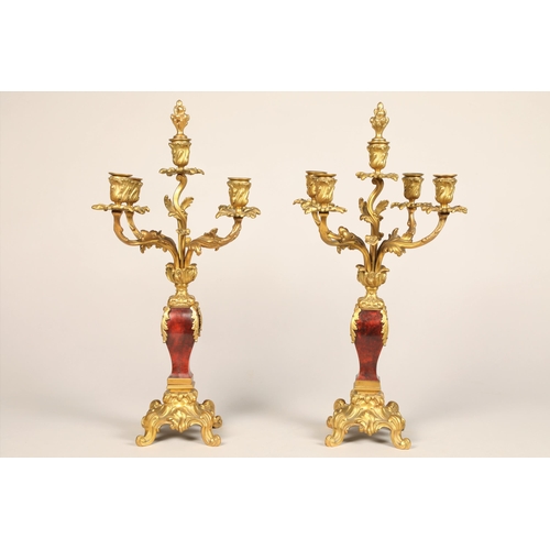 301 - 19th century French three piece tortoiseshell and ormolu mounted clock garniture, white enamel dial,... 