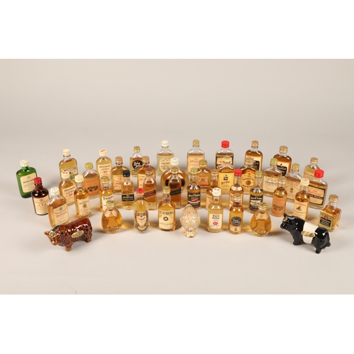 357 - Collection of eighty-nine whisky miniatures, two sets of The Malt encyclopaedia Beneagles ceramic mi... 