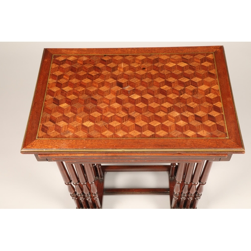 614 - Set of mahogany nest of quartet tables, the tops decorated with geometric parquetry, raised on slend... 