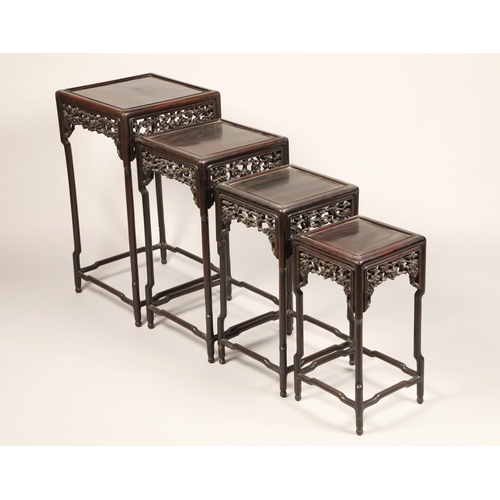 616 - Nest of four Chinese hardwood tables, rectangular painted tops with raised moulded edges above a fri... 